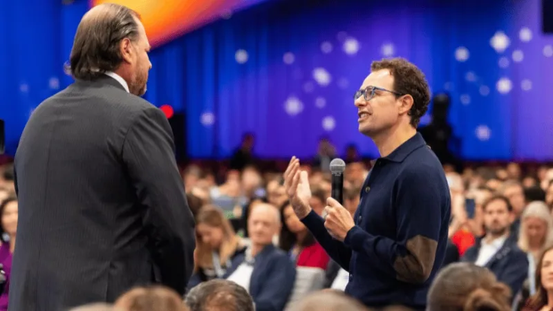 Anthropic’s Dario Amodei speaks with Salesforce’s Marc Benioff among the audience at Dreamforce 2026 — Credit: Salesforce